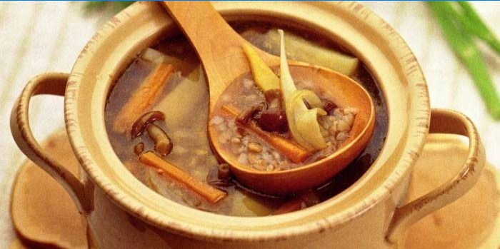 Mushroom soup with buckwheat in a pot