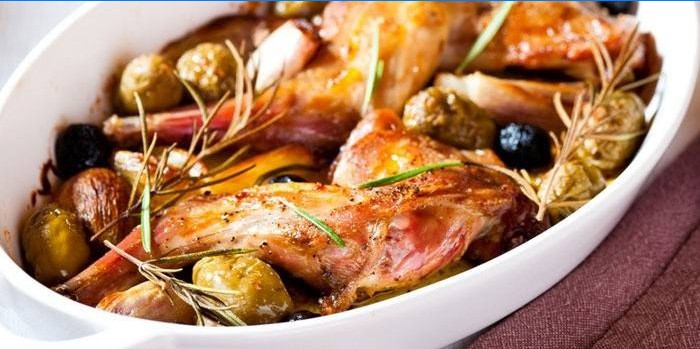 Baked rabbit meat with olives and rosemary