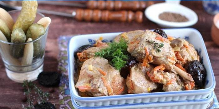 Baked rabbit meat in a form with prunes and carrots