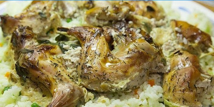Sliced ​​baked rabbit on a pillow of rice