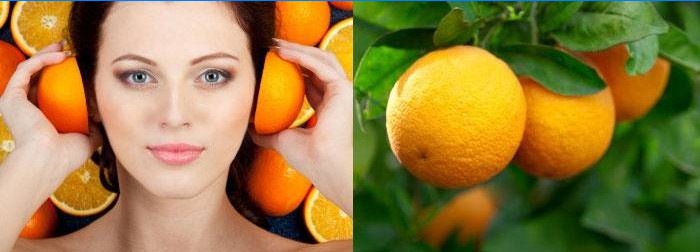 Woman holds oranges