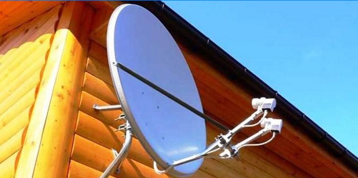 Satellite dish on the wall of a private house