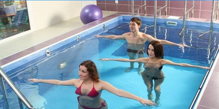 Guy and girls do aqua aerobics