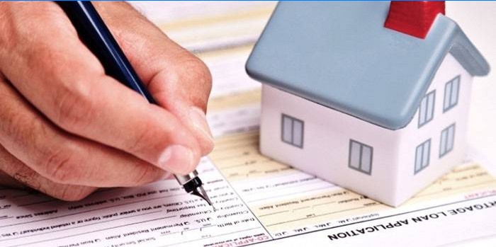 A man fills out a mortgage application form