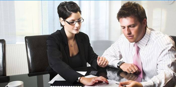 Man and woman at office work with documents