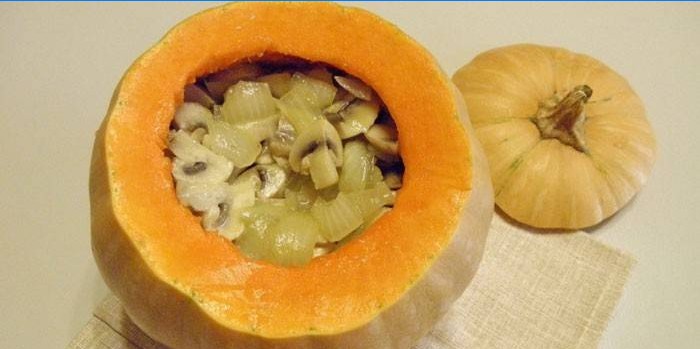Pumpkin stuffed with meat with mushrooms