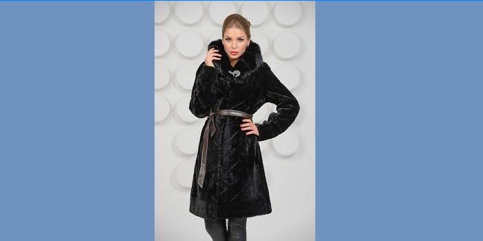 Girl in a black mouton coat with mink trim