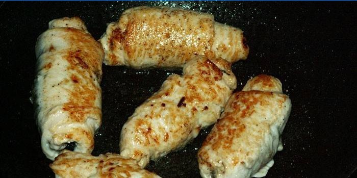 Fried chicken rolls in a pan