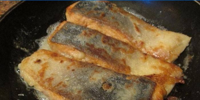 Fried coho salmon in a pan