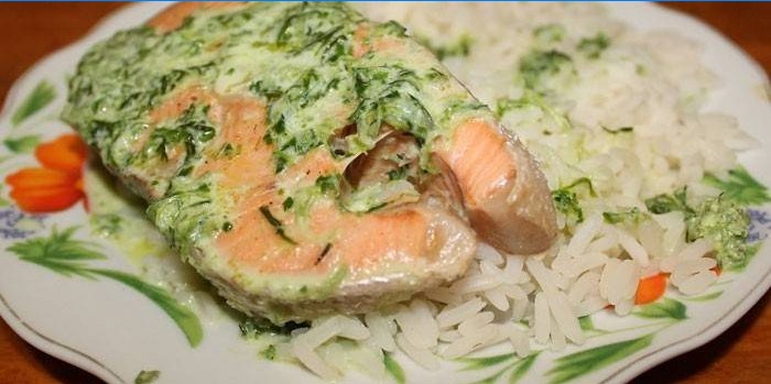 Coho salmon in a creamy sauce with rice garnished