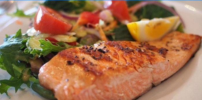 Baked coho salmon fillet with salad
