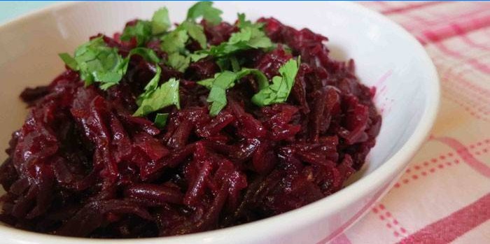 Grated boiled beet salad with vinegar and herbs