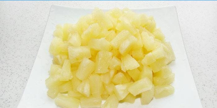 Pieces of canned pineapple on a plate