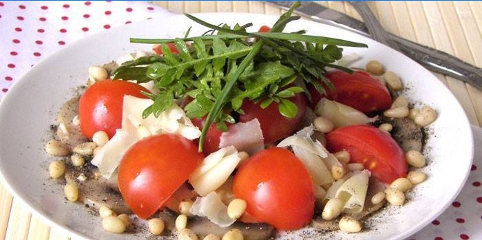 Salad with cherry tomatoes, parmesan and pine nuts