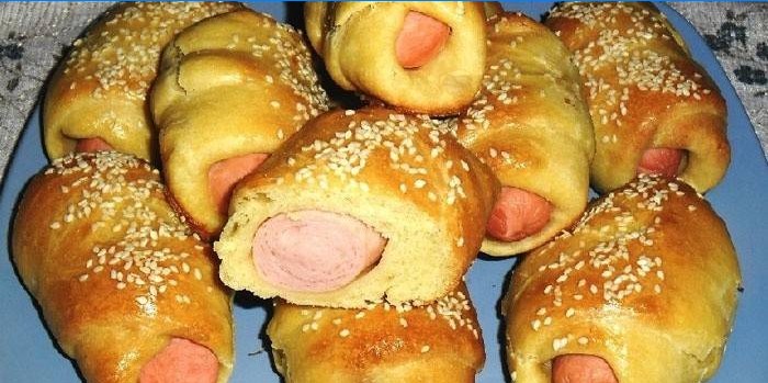 Sausages in the test sprinkled with sesame seeds
