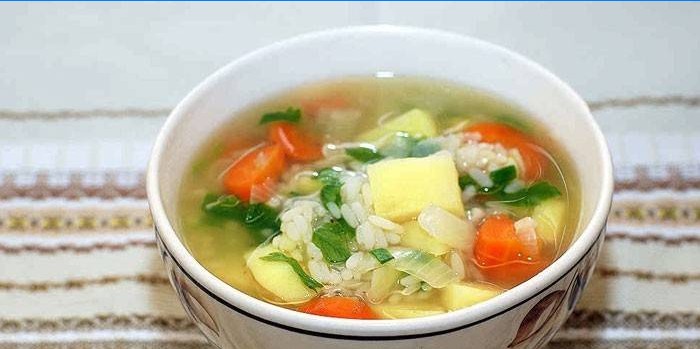 Pork broth soup with rice and vegetables