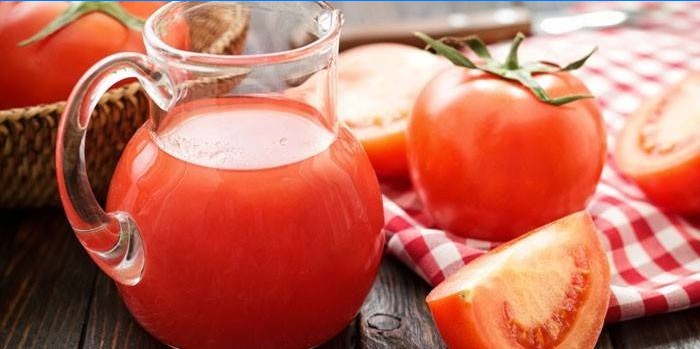 Tomato juice in a jug and tomato