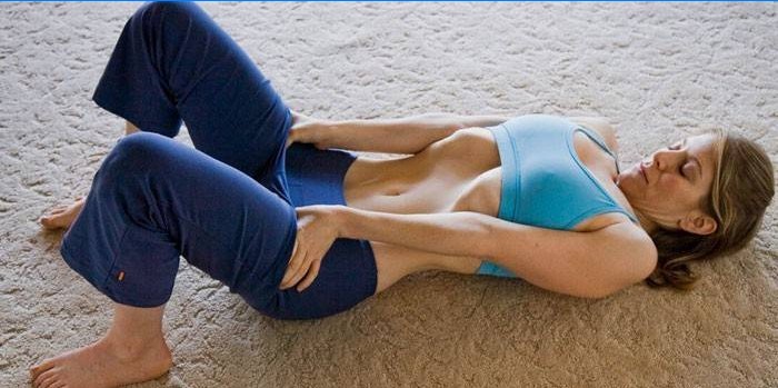 Girl doing abdominal vacuum exercise