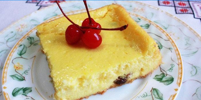 Slice of cottage cheese casserole with cherry