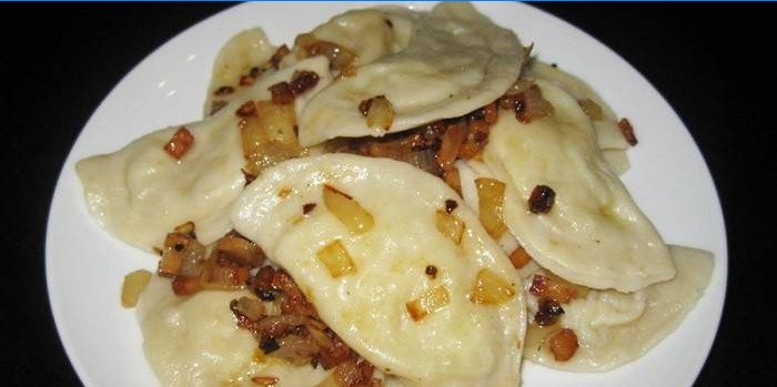 Dumplings stuffed with potatoes with fried onions