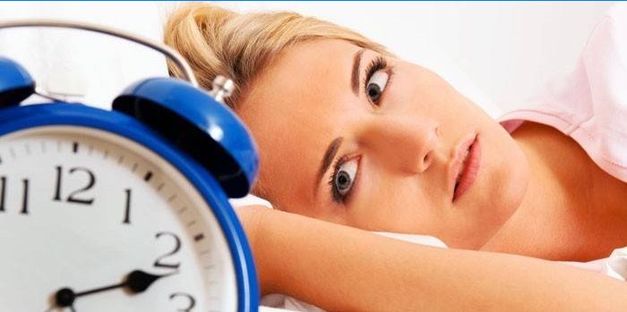 Woman and alarm clock