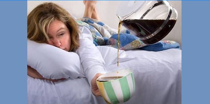 Girl with a hangover is pouring tea into a cup
