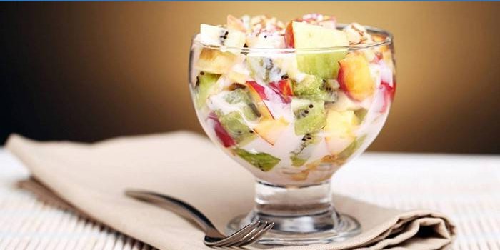 Fruit salad with yogurt in a glass