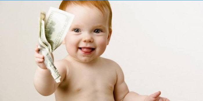 Little child with money in hand