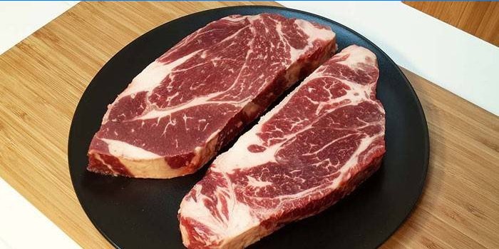 Two slices of marbled beef for steaks
