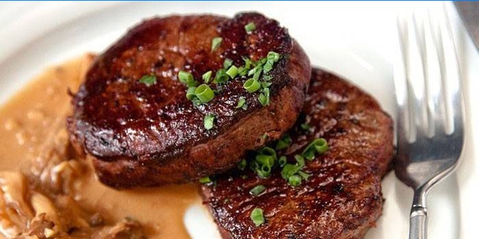 Two filet mignon steaks on a plate