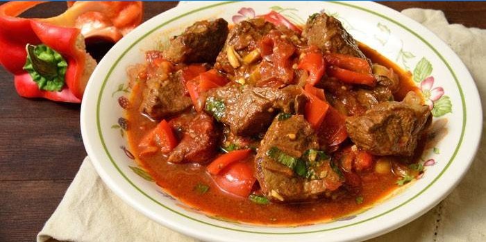 Pork goulash with vegetables and gravy on a plate