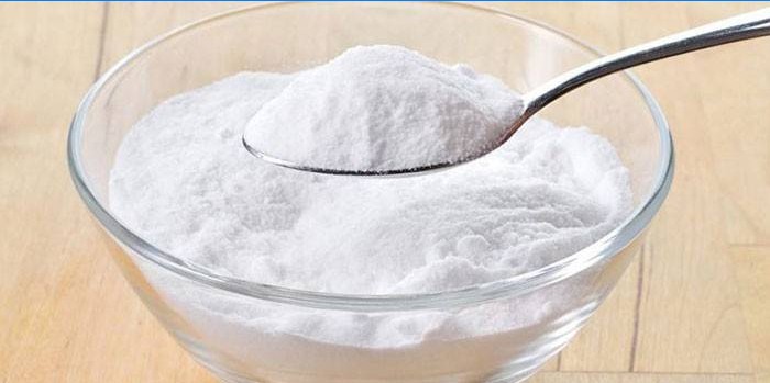 Baking soda in a plate and spoon