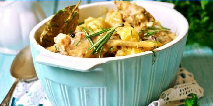 Braised rabbit stewed in sour cream with potatoes and Provencal herbs