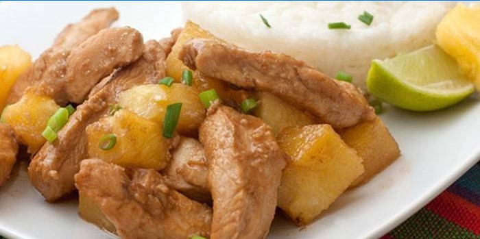 Chicken meat with pineapple slices in teriyaki sauce