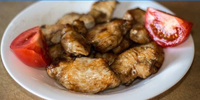Sliced ​​chicken in soy sauce on a plate