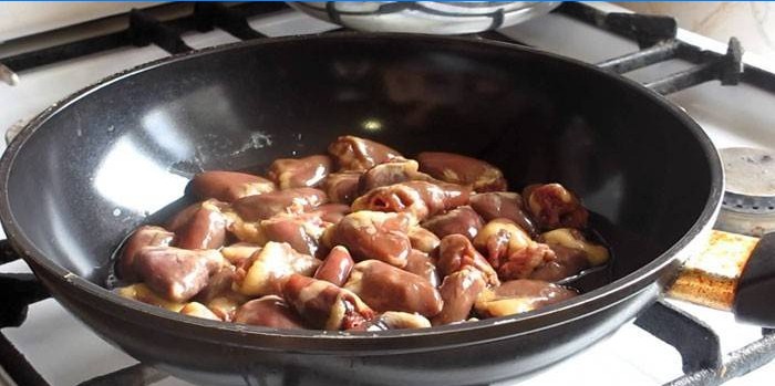 Chicken hearts in a pan