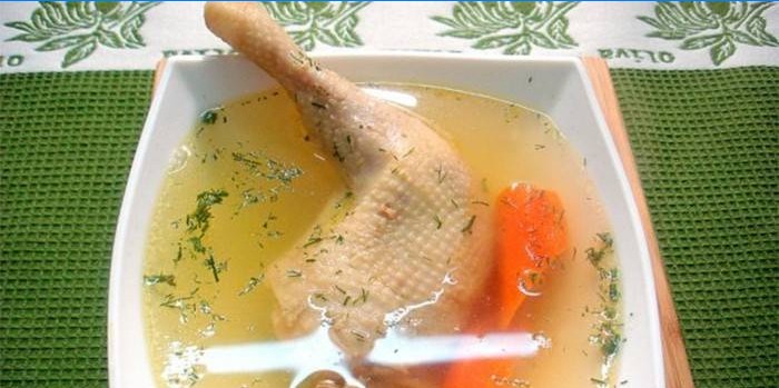 Chicken legs broth in a plate