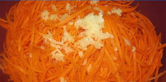 Chopped carrots and garlic in a bowl