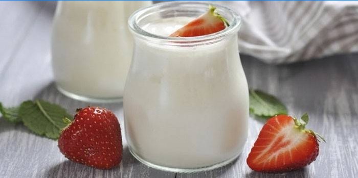 Natural yogurt with strawberries in a jar