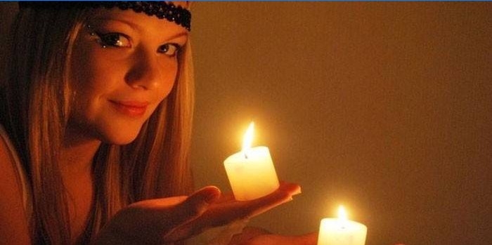 Girl with candles in hands