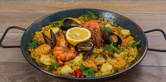 Classic spanish paella with seafood in a pan