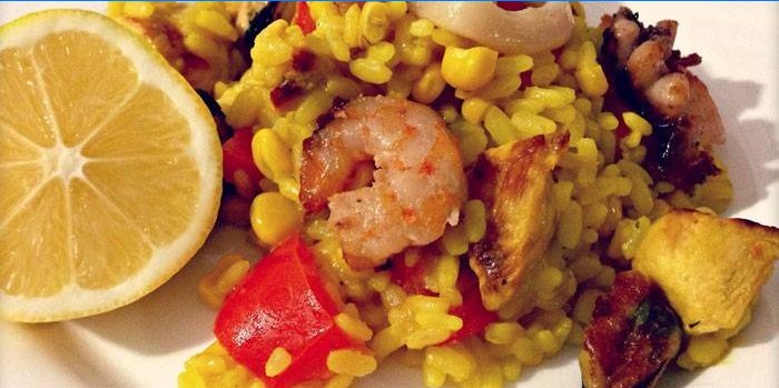 Paella with chicken and seafood on a plate