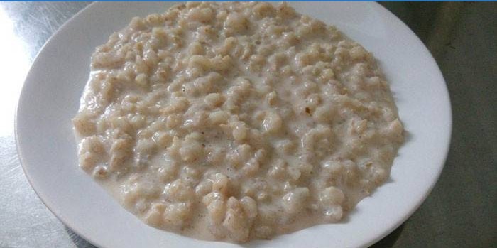 Milk pearl barley porridge in a plate