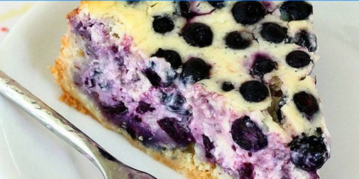 Slice of blueberry pie with sour cream filling