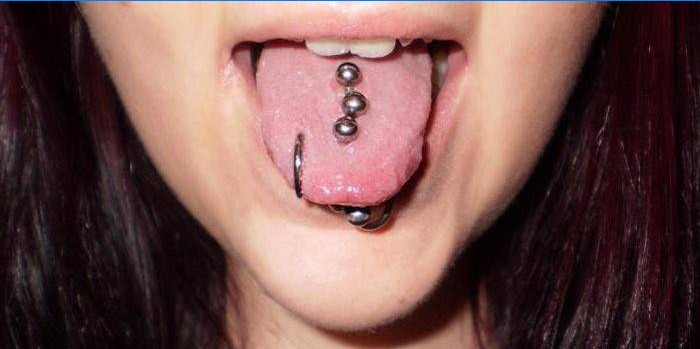 A few earrings in the tongue