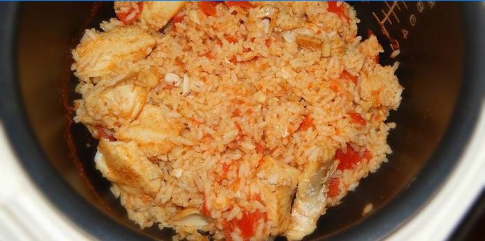 Pilaf with fish and tomatoes in a slow cooker
