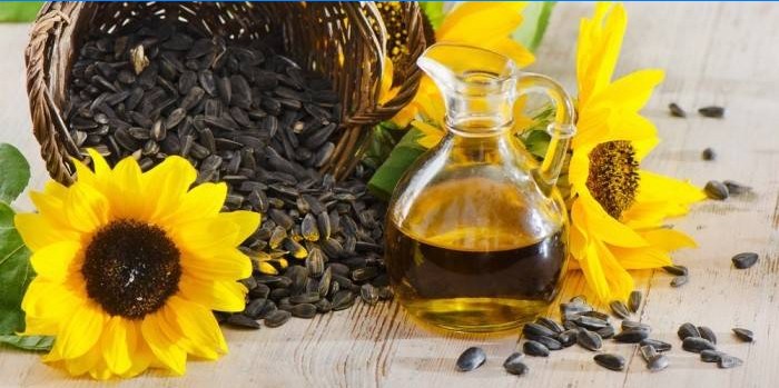 Sunflower seeds and sunflower oil in a glass jar