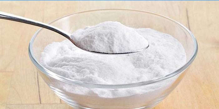 Baking soda in a spoon and plate