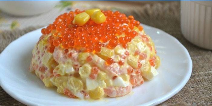 Royal salad with seafood and red caviar