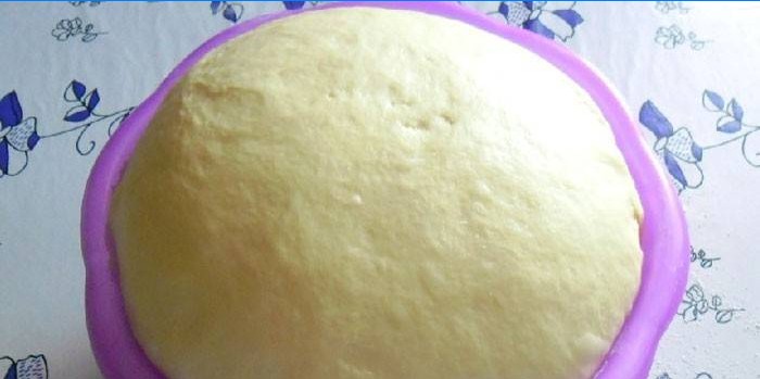 Butter dough in a bowl before cutting